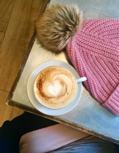 Coffee and hat on a table
